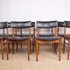 Set of 8 Danish chairs in teak, black leatherette and brass, Sven Chrobat/Sax.
