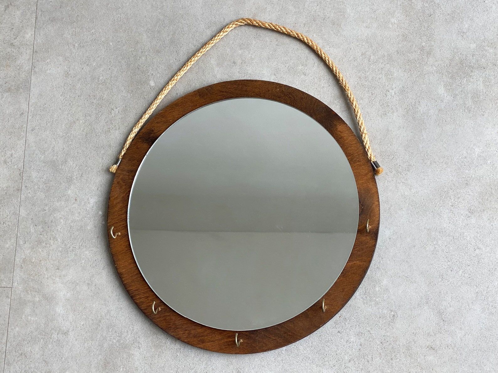 Vintage round wooden wall mirror with hooks
