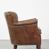 Nice, subtle cowhide armchair with a reversible kilim seat cushion