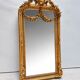 Miroir baroque doré avec guirlande de fleurs