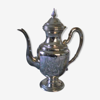 Empire-style silver metal teapot.