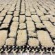 Large cream and black checked Berber rug, 280 × 200 cm.