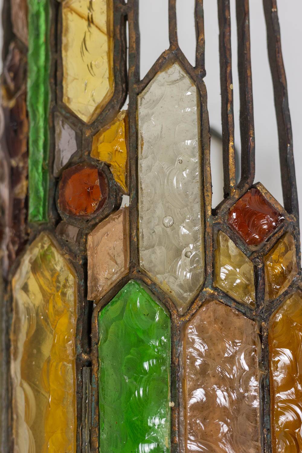 Wrought iron and colored glass wall light. 1960s.