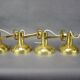 Set of four adjustable brass wall lights, Germany, 1960s.