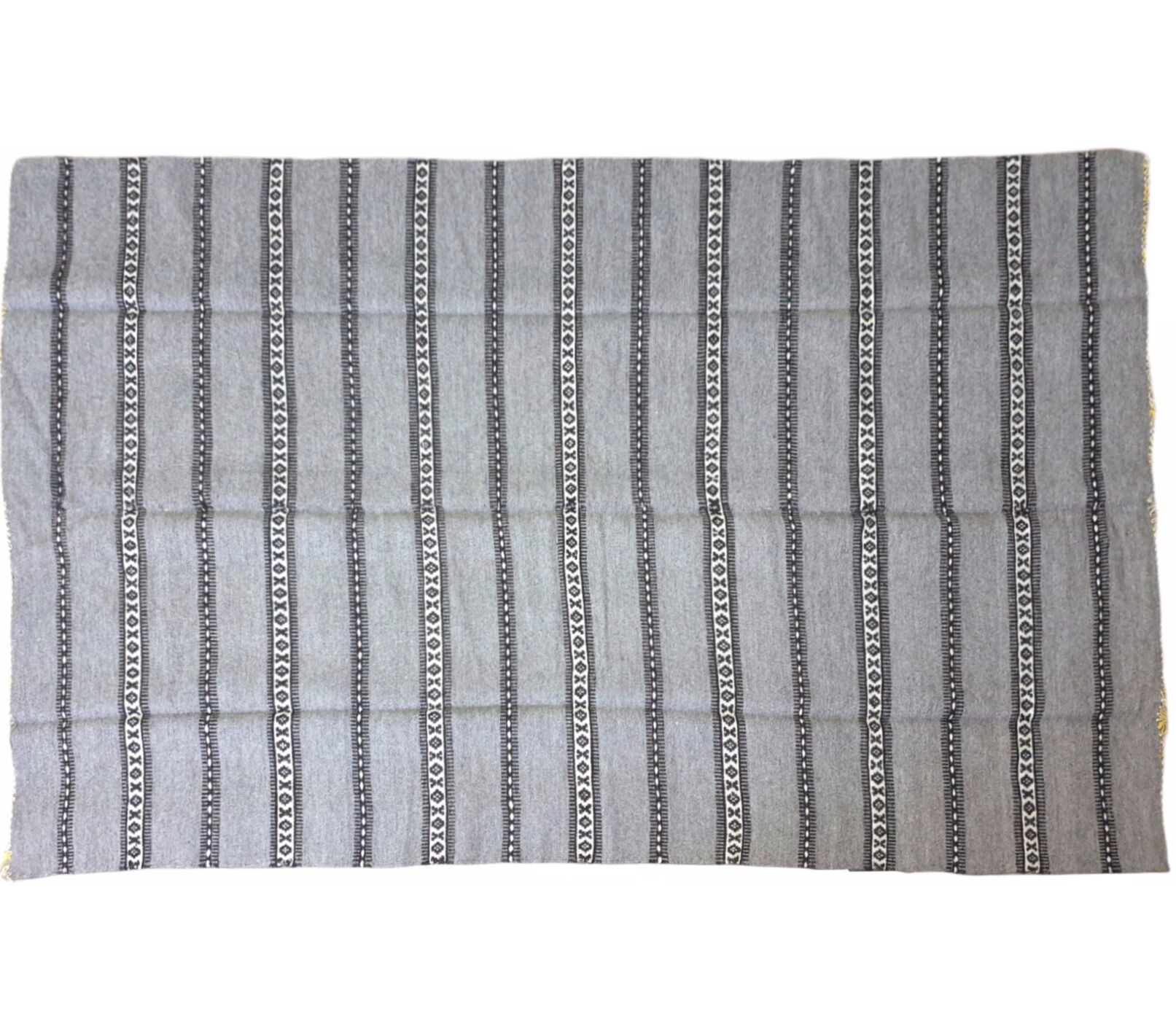 Handwoven vintage geometrical rug, grey background