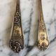 Duo of silver metal spoons