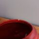 Poet Laval swan hides zoomorphic pot in burgundy ceramic.