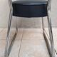 Vintage office chair in chrome metal and faux leather.