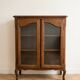 Small low Louis XV wooden display cabinet.