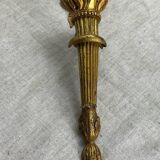 Bronze wall light, decorated with a bow and ribbon.