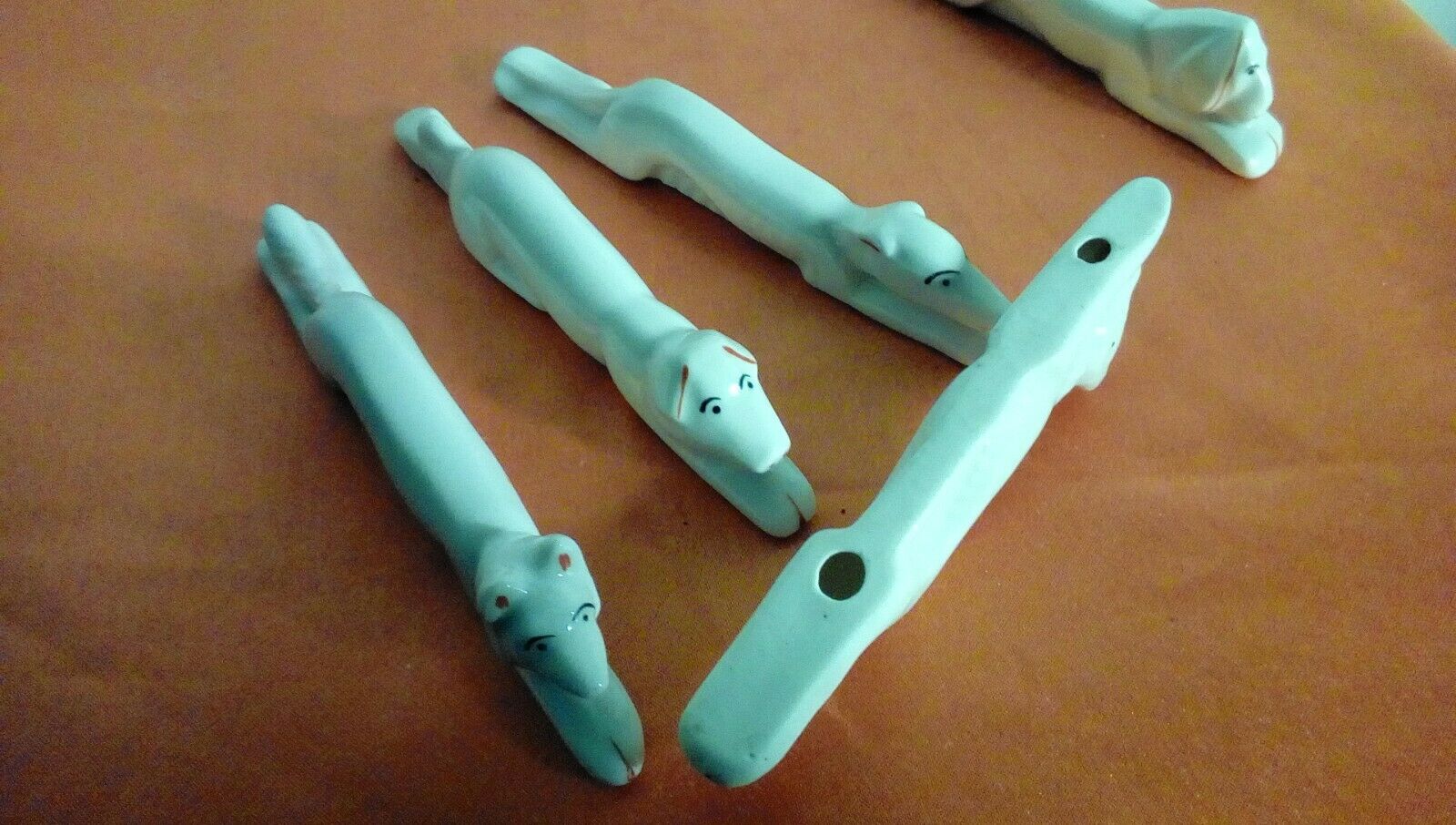 Suite of 5 porcelain knives about animal dog