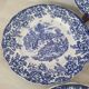 4 earthenware plates with floral and pastoral scene motif