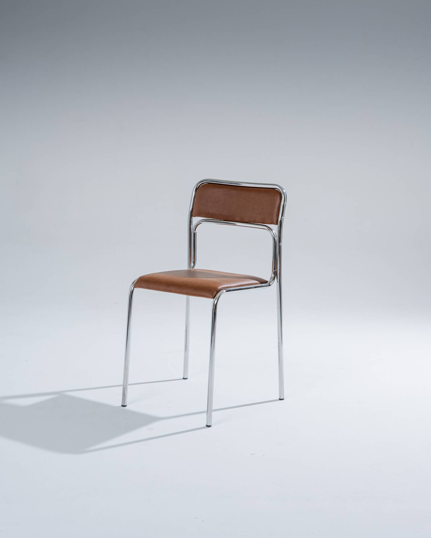 Tubular steel and cognac leatherette chair, 1980s
