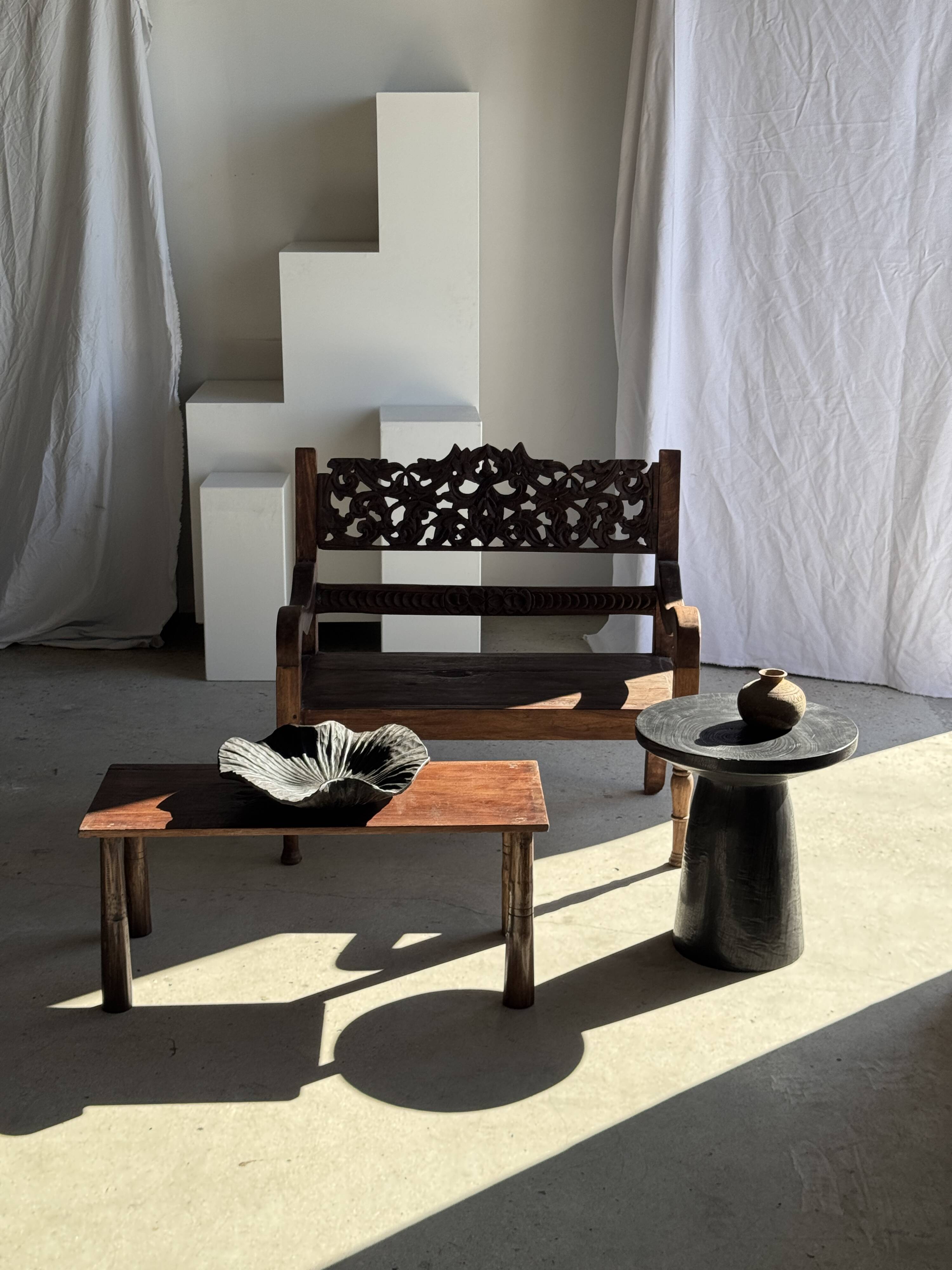 Black solid mango side table (monoxyle) with conical legs