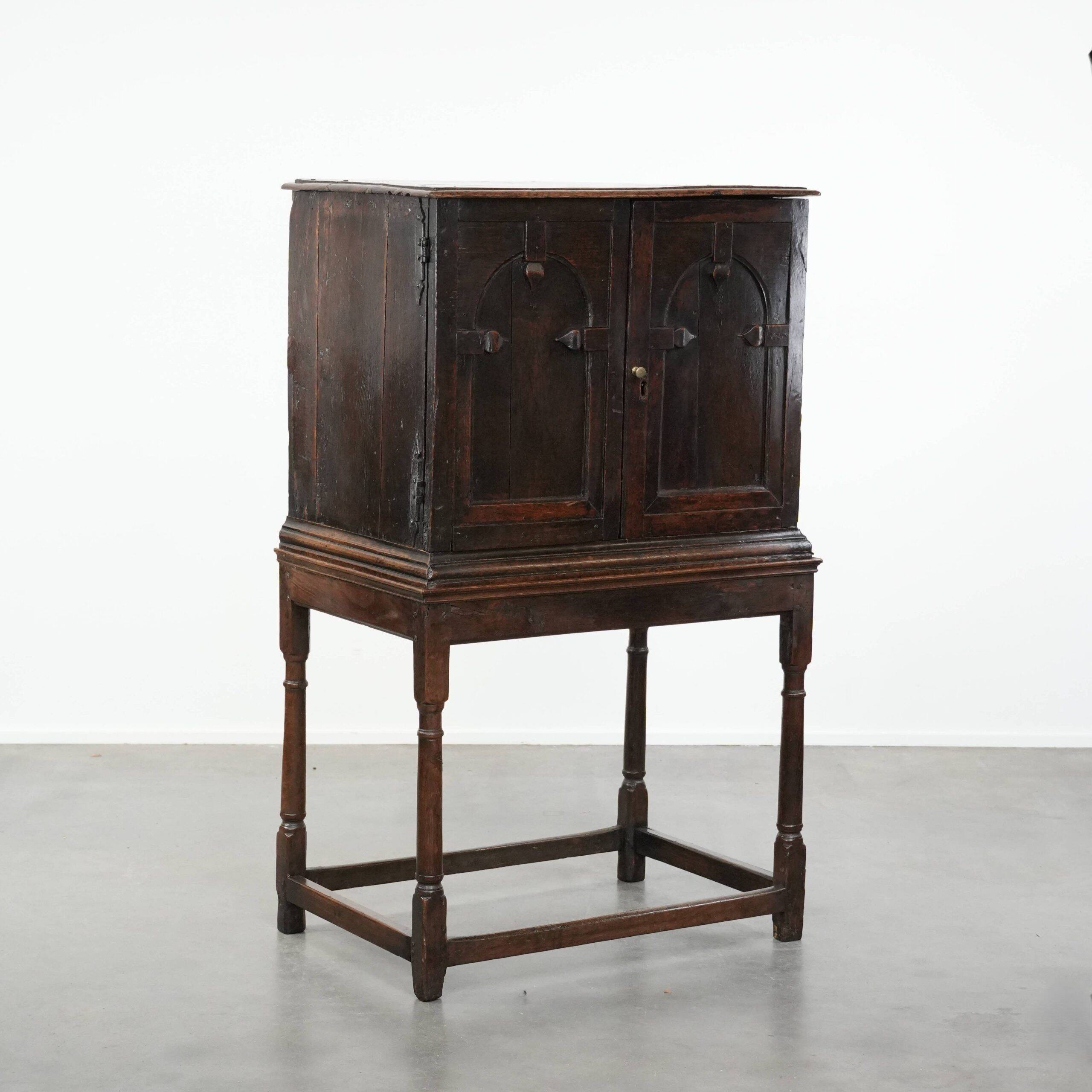 Unique antique English cabinet on stand made of oak from the 17th century