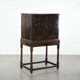 Unique antique English cabinet on stand made of oak from the 17th century