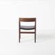 Fauteuil en palissandre et cuir noir, par J. Norgaard, Danemark, années 1960.