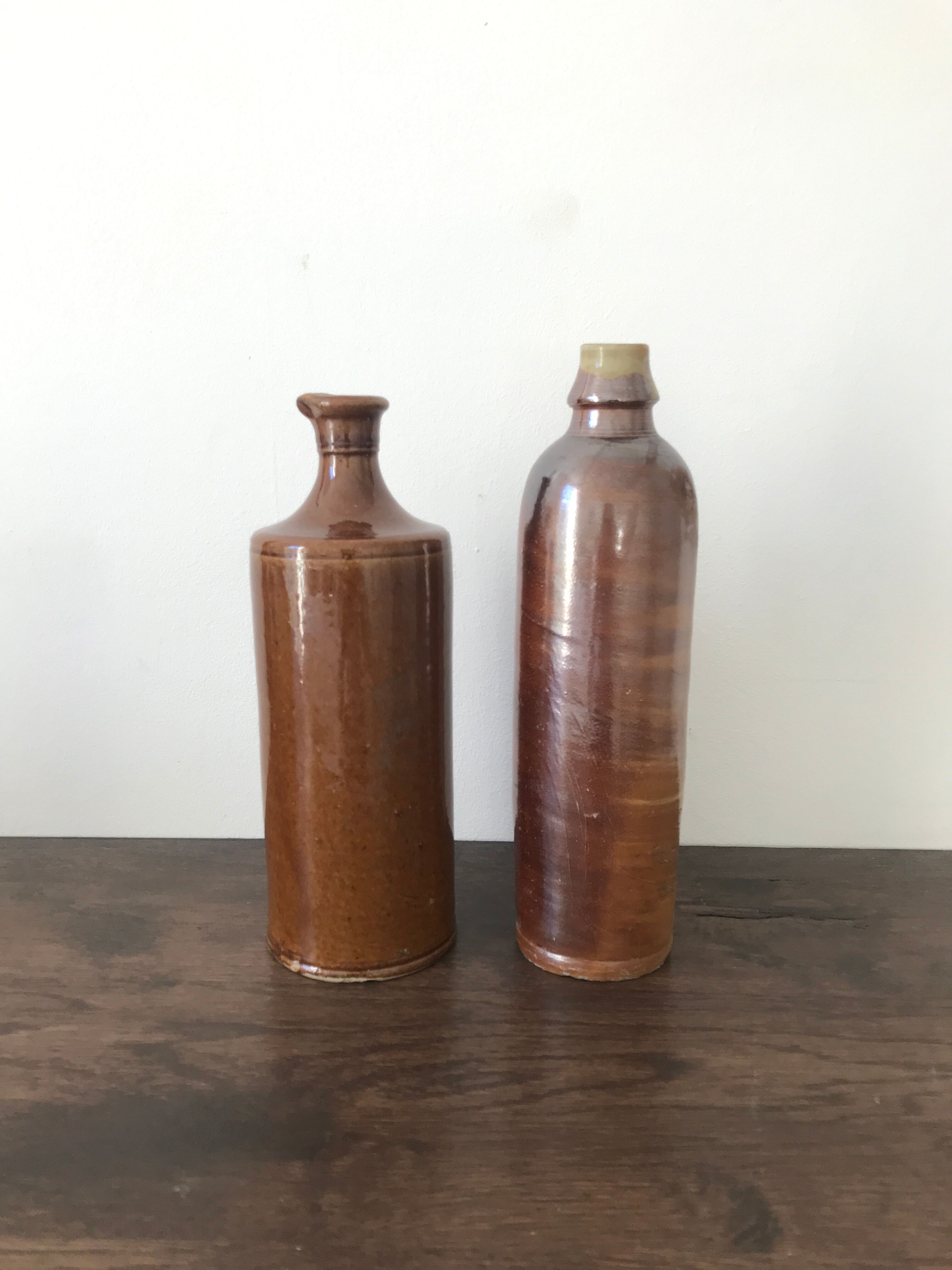 Pair of sandstone bottles