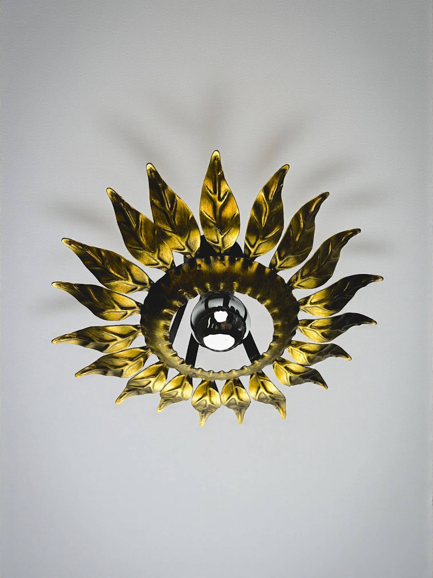 Sunburst ceiling light fixture or sconce in gilt wrought iron, Spain, circa 1960s
