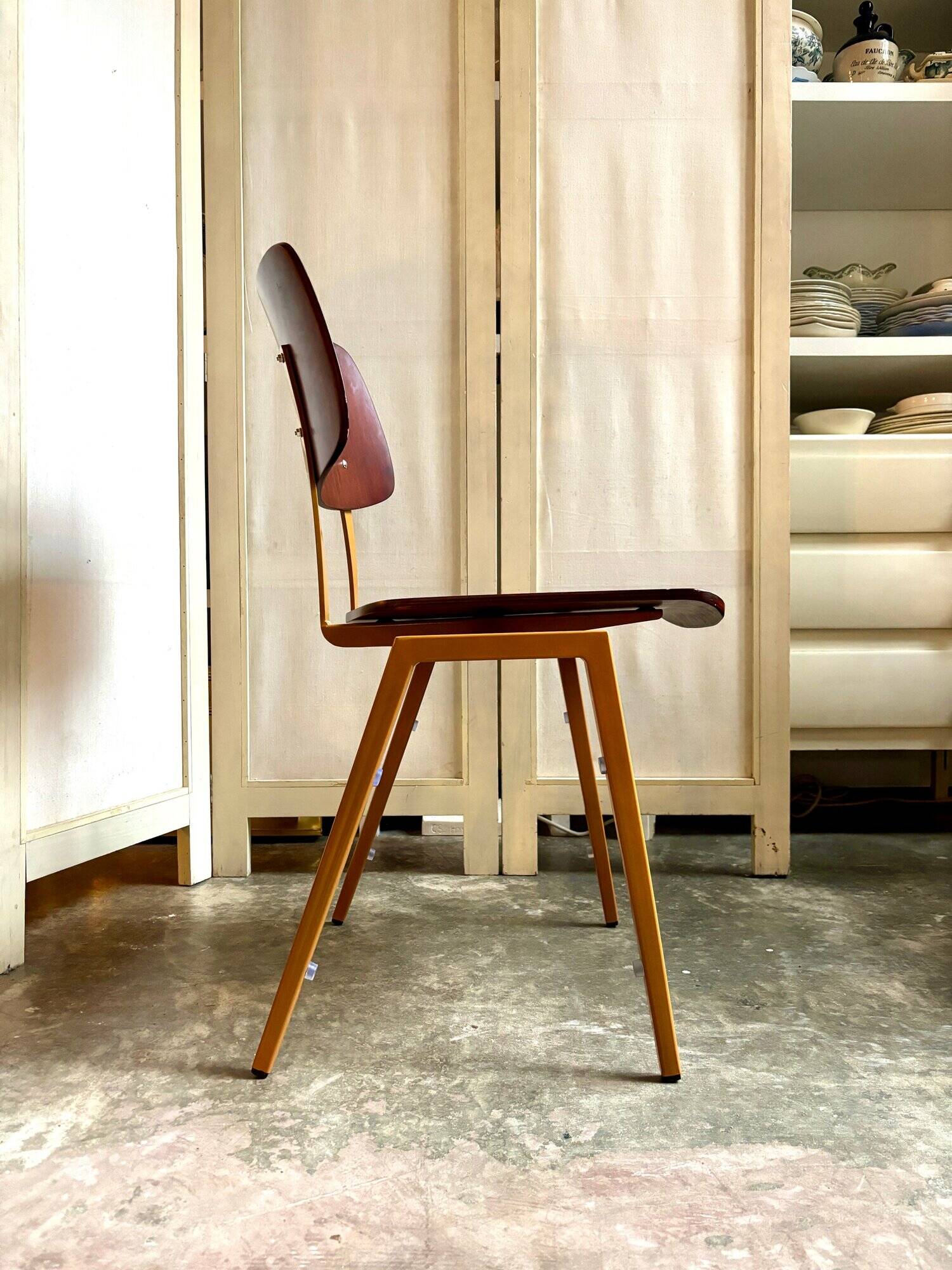 Chair in dark wood and ocher metal