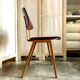 Chair in dark wood and ocher metal