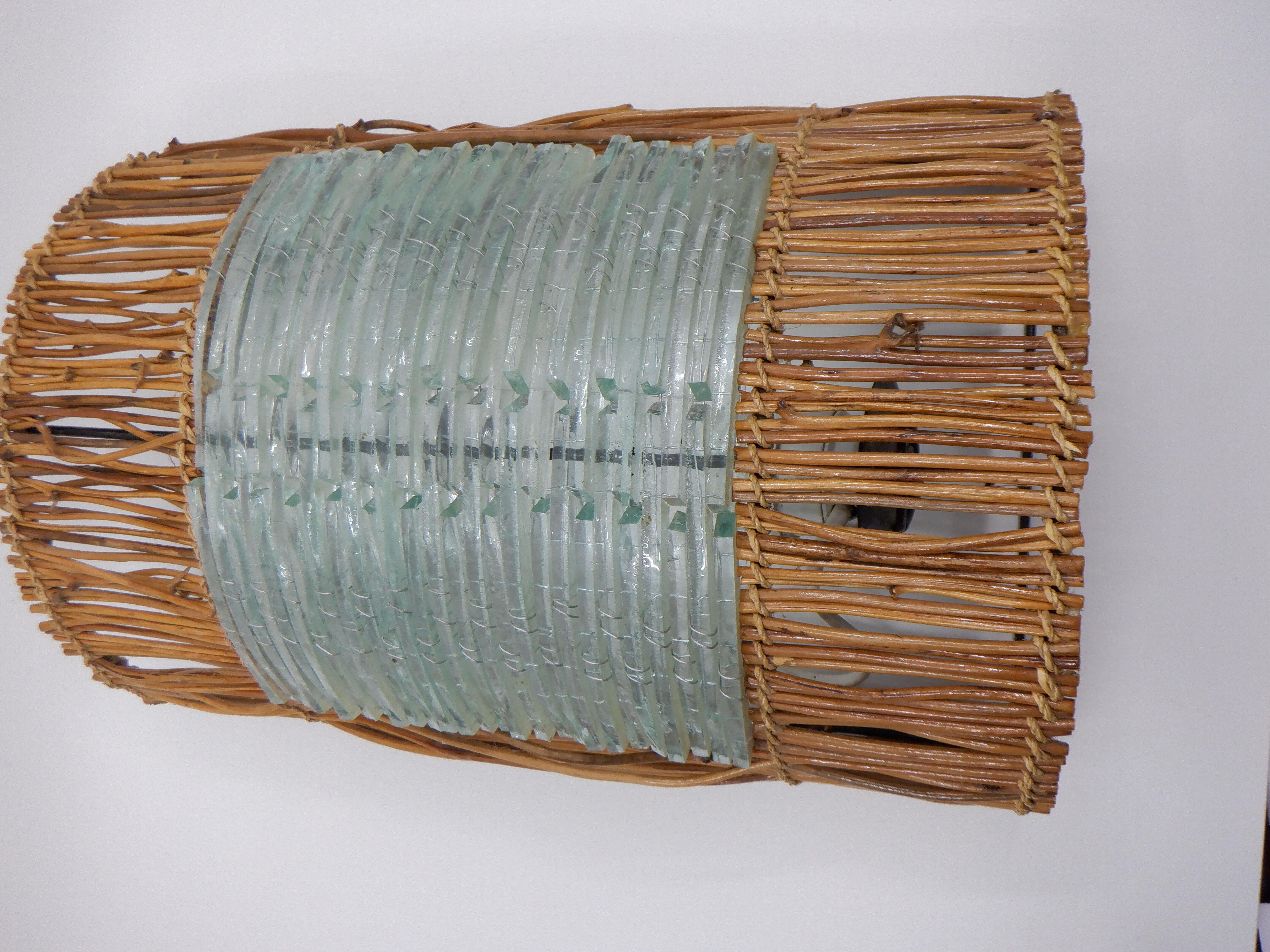 Glass and rattan sconce