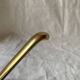 Vintage coat rack in lacquered metal with three golden aluminum hooks