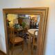 Grand miroir ancien en bois patiné doré