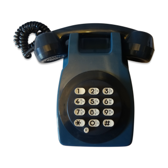 Téléphone mural bleu vintage