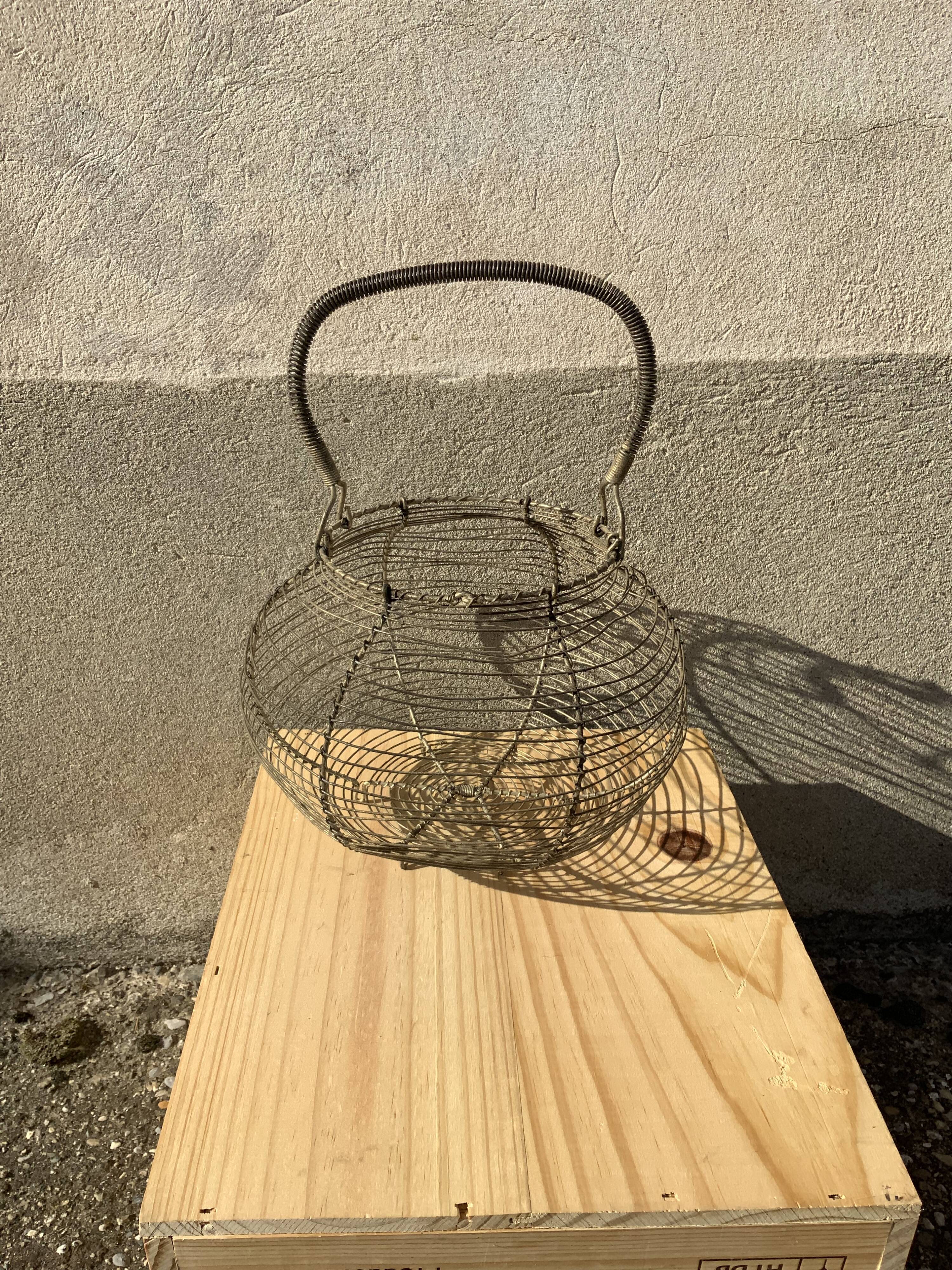 Vintage iron egg basket with hanse antique