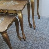 Set of three nesting tables in gilded wood in Florentine style Hollywo.