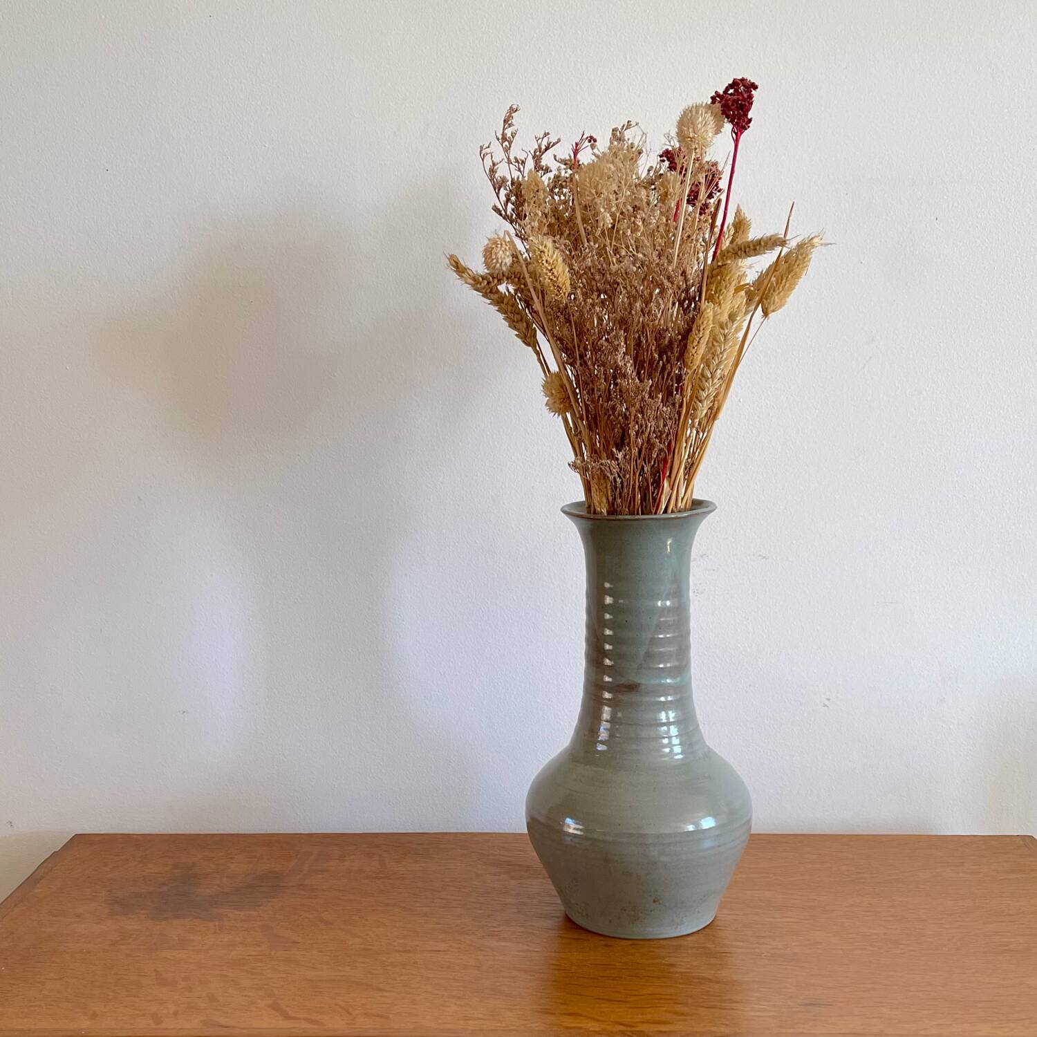 Glazed stoneware based, signed.