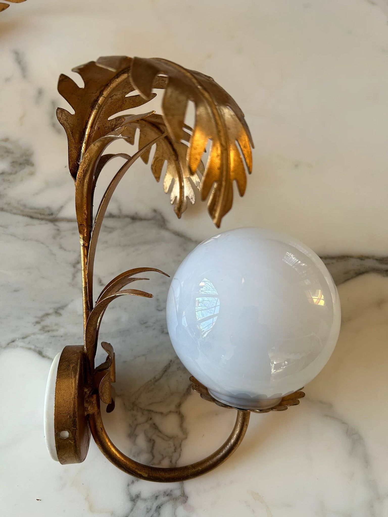 Pair of palm leaf wall lights in Hollywood Regency style with opaque globes by Hans Kögl, Germany, 1970s.