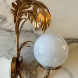 Pair of palm leaf wall lights in Hollywood Regency style with opaque globes by Hans Kögl, Germany, 1970s.