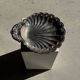 Large antique silver-plated bowl in the shape of a shell.