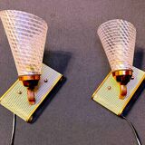 Pair of brass sconces, perforated metal and perhapx conical lampshade, France 50's