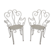 Pair of wrought iron garden chairs