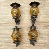 Medieval style metal and amber glass wall lamp