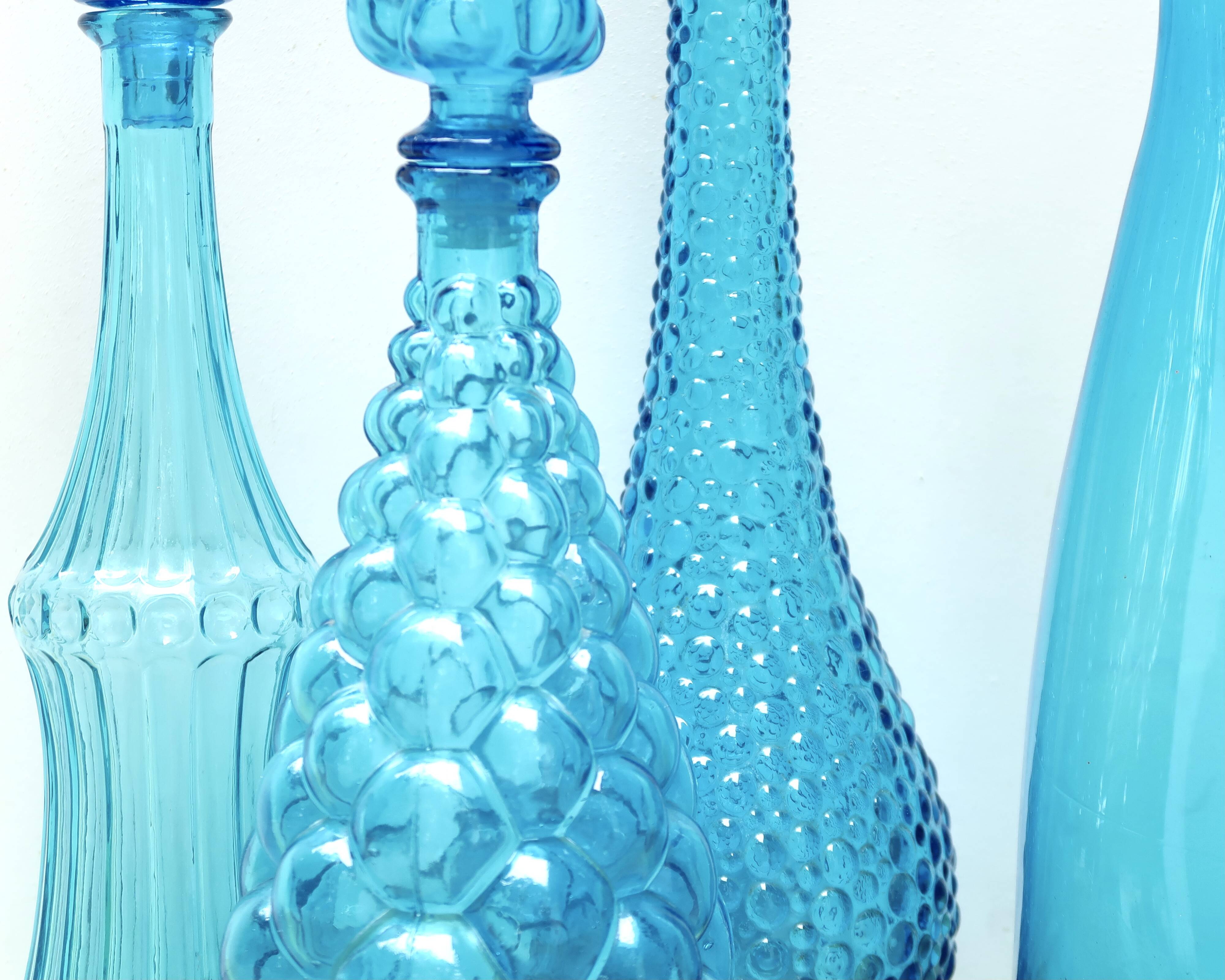 Set of four Italian blue glass carafes, 1960s
