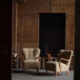 Pair of Mid Century Modern Swedish lounge chairs in birch and lamb's wool, 1960s.