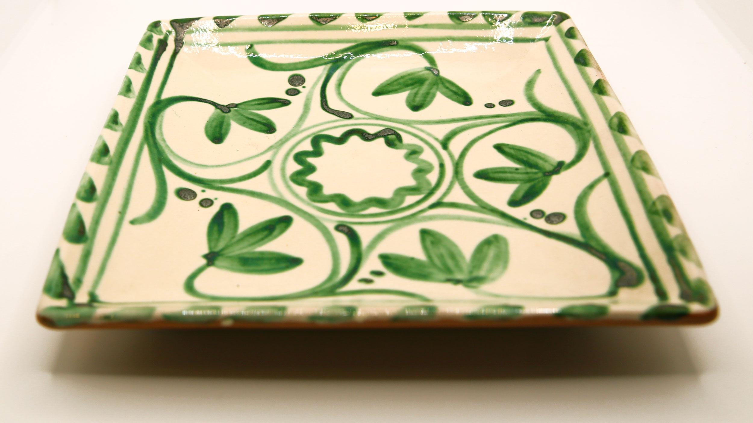Square Mediterranean glazed earthenware dish with green flowers