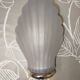Art Deco wall sconces in frosted glass with a seashell design