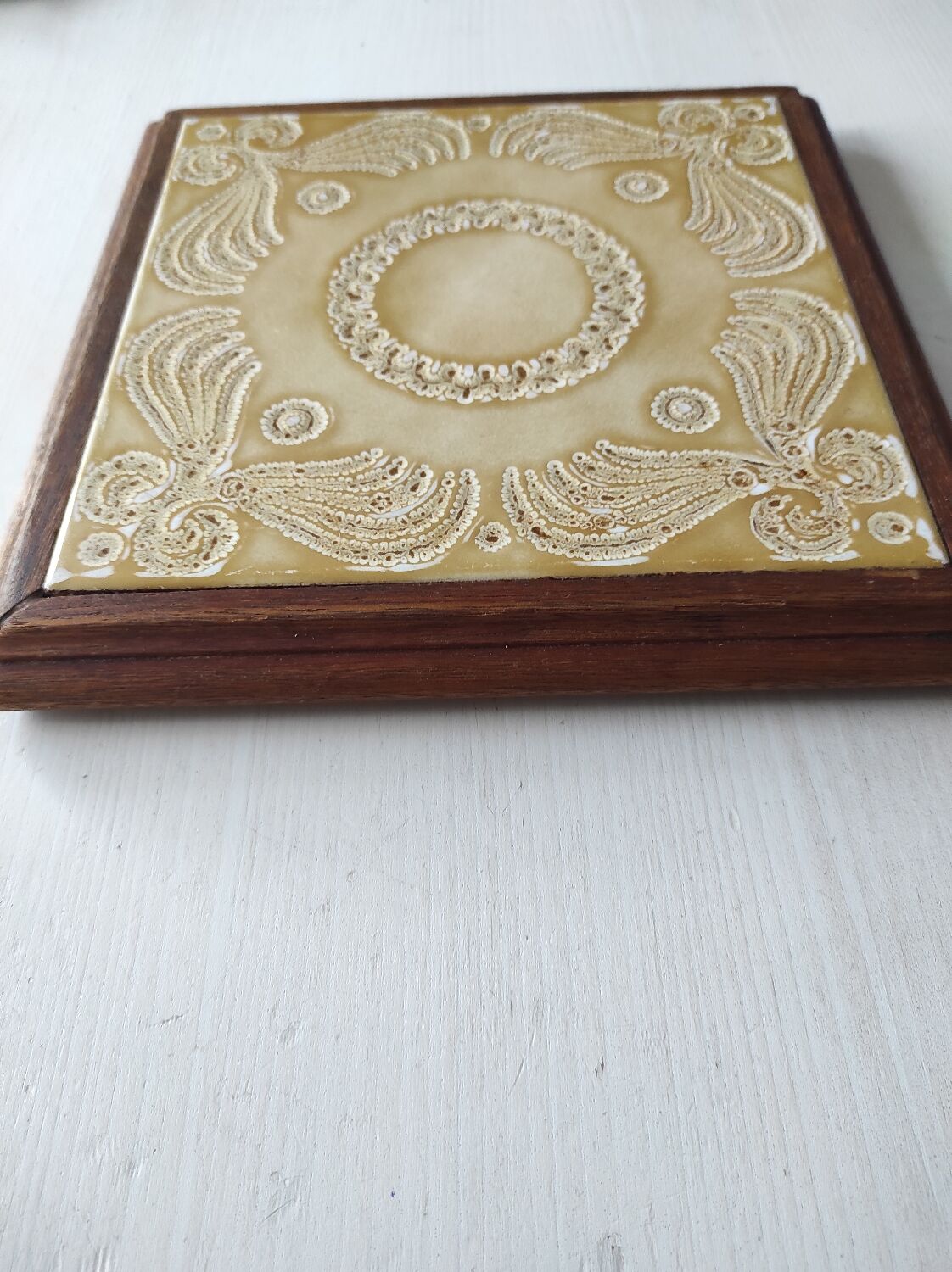 Wooden and ceramic trivet