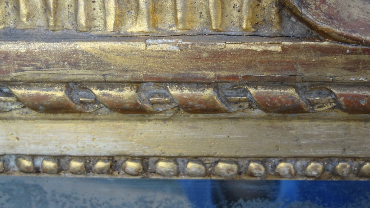 Louis XVI period mirror in gilded carved wood