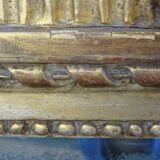 Louis XVI period mirror in gilded carved wood