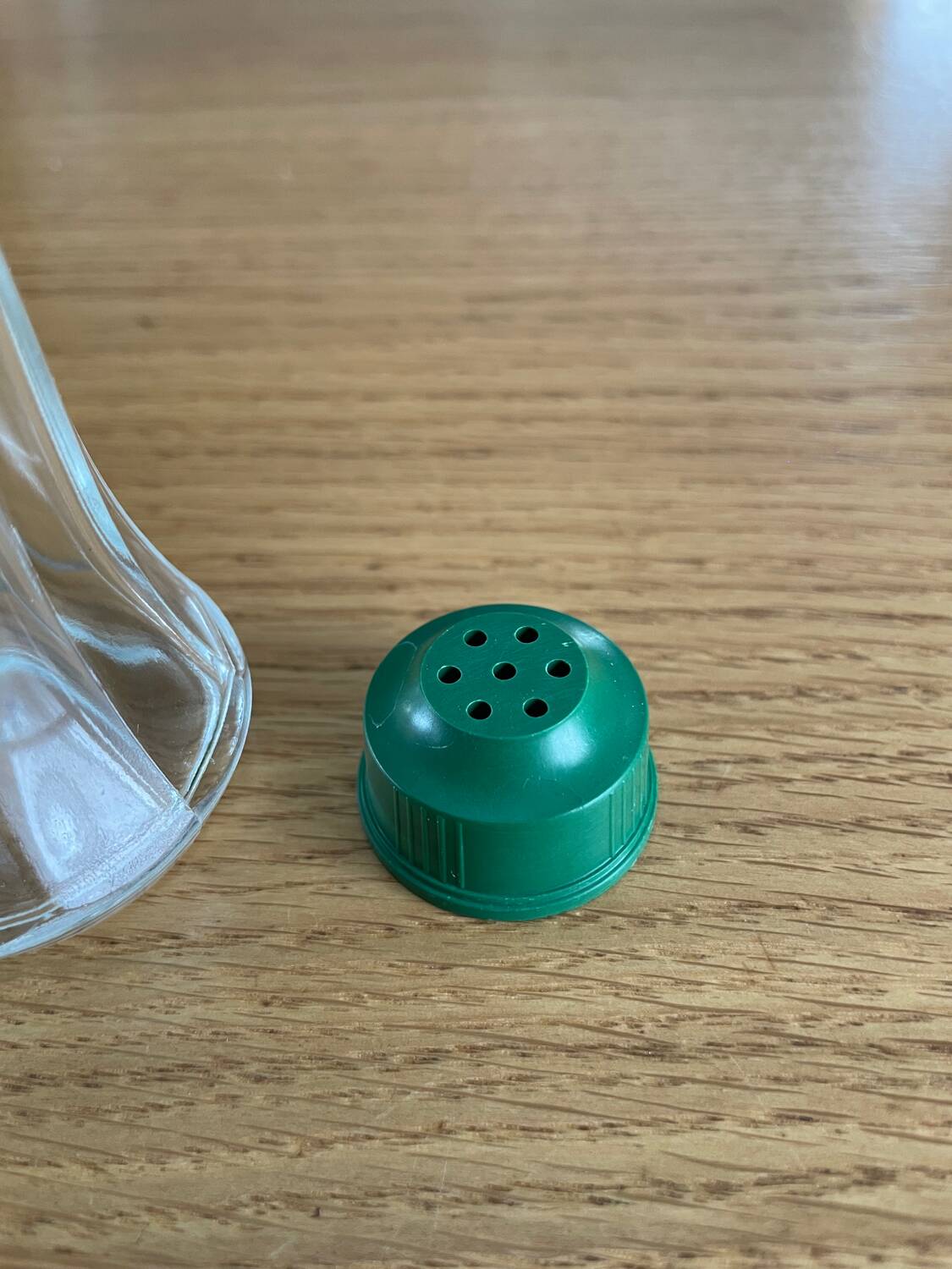 Vintage salt shaker with green Bakelite cap