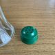 Vintage salt shaker with green Bakelite cap