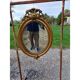 Miroir ovale en bois et stuc doré 19ème