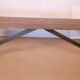 Old bench in Burmese teak with a wrought iron base.