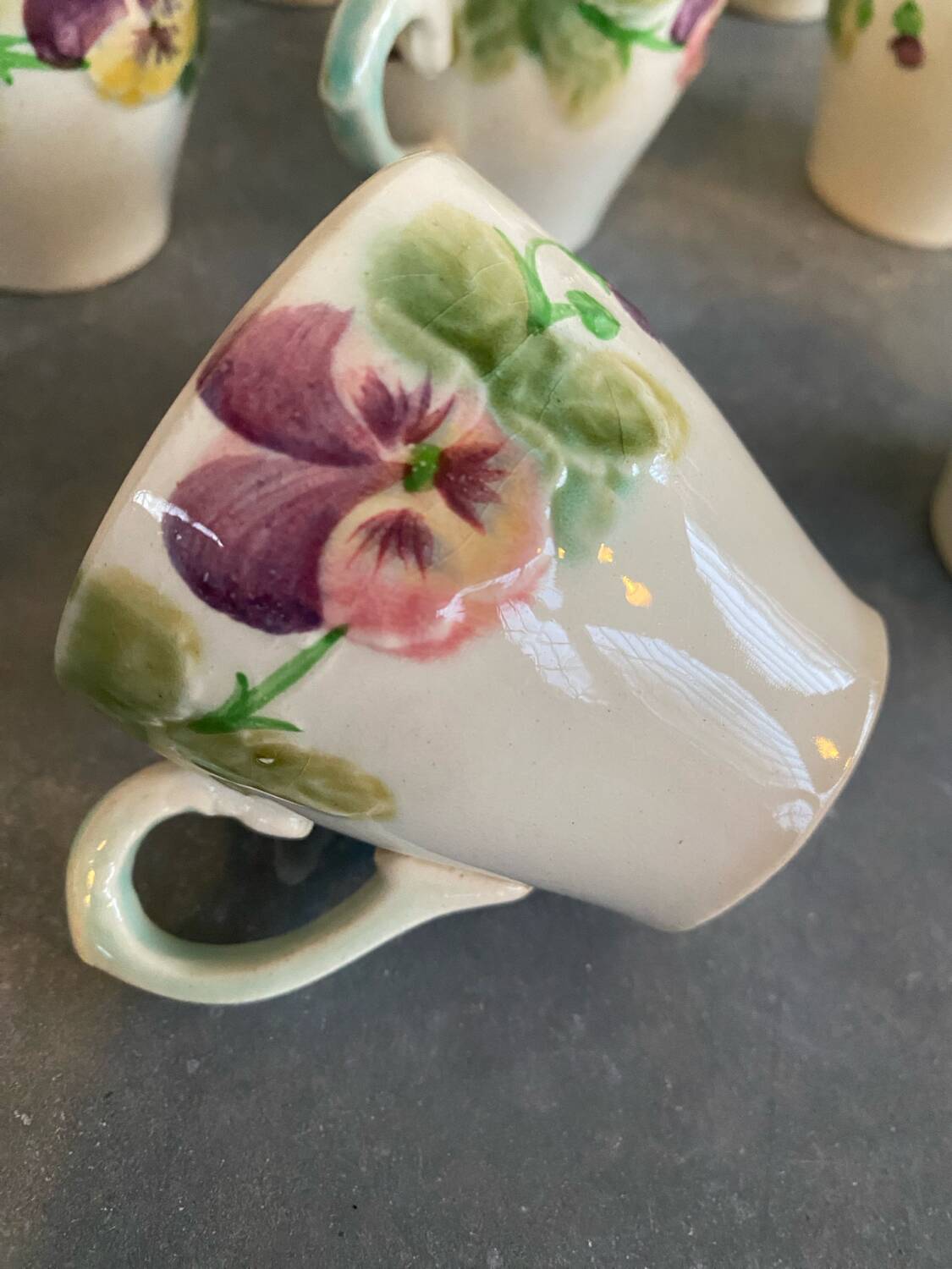 10 slipware cups, pansies